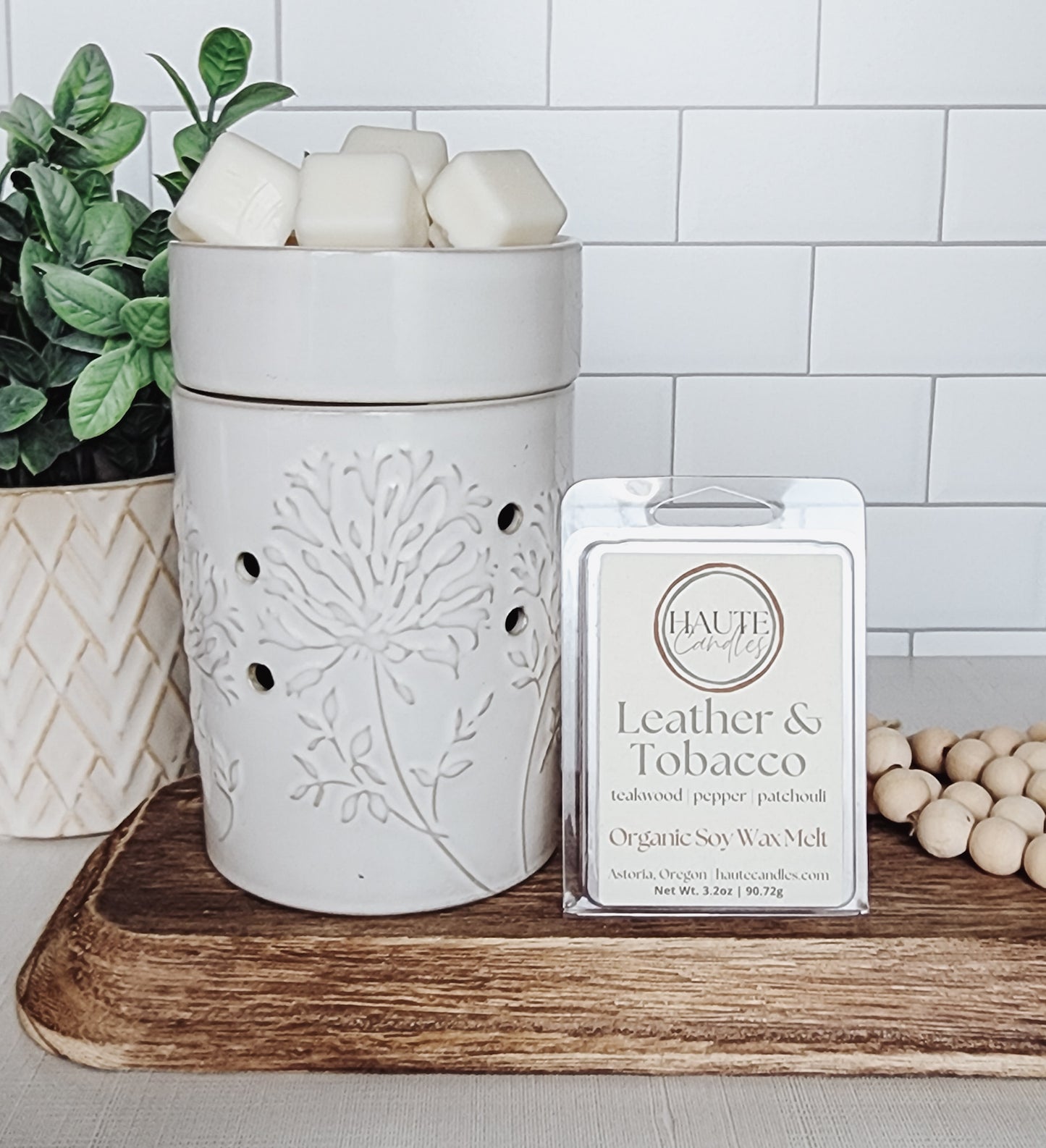 Haute Candles Leather & Tobacco soy wax melts in an electric fragrance warmer 